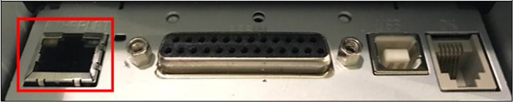 A photo of the back of the back of the Impact printer, with the ethernet port highlighted by a red box.