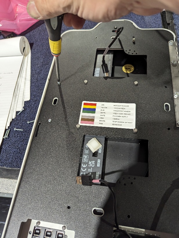 MM6 Mini - reinstalling small screws on door.jpg