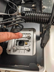 A finger pointing at a computer