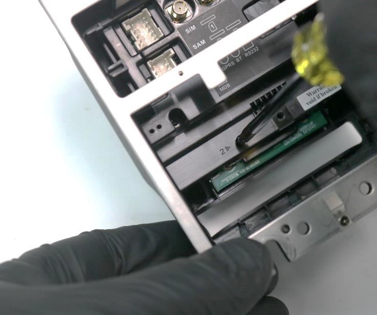 PayPlus Omni - Mounting screw being removed on terminal.jpg