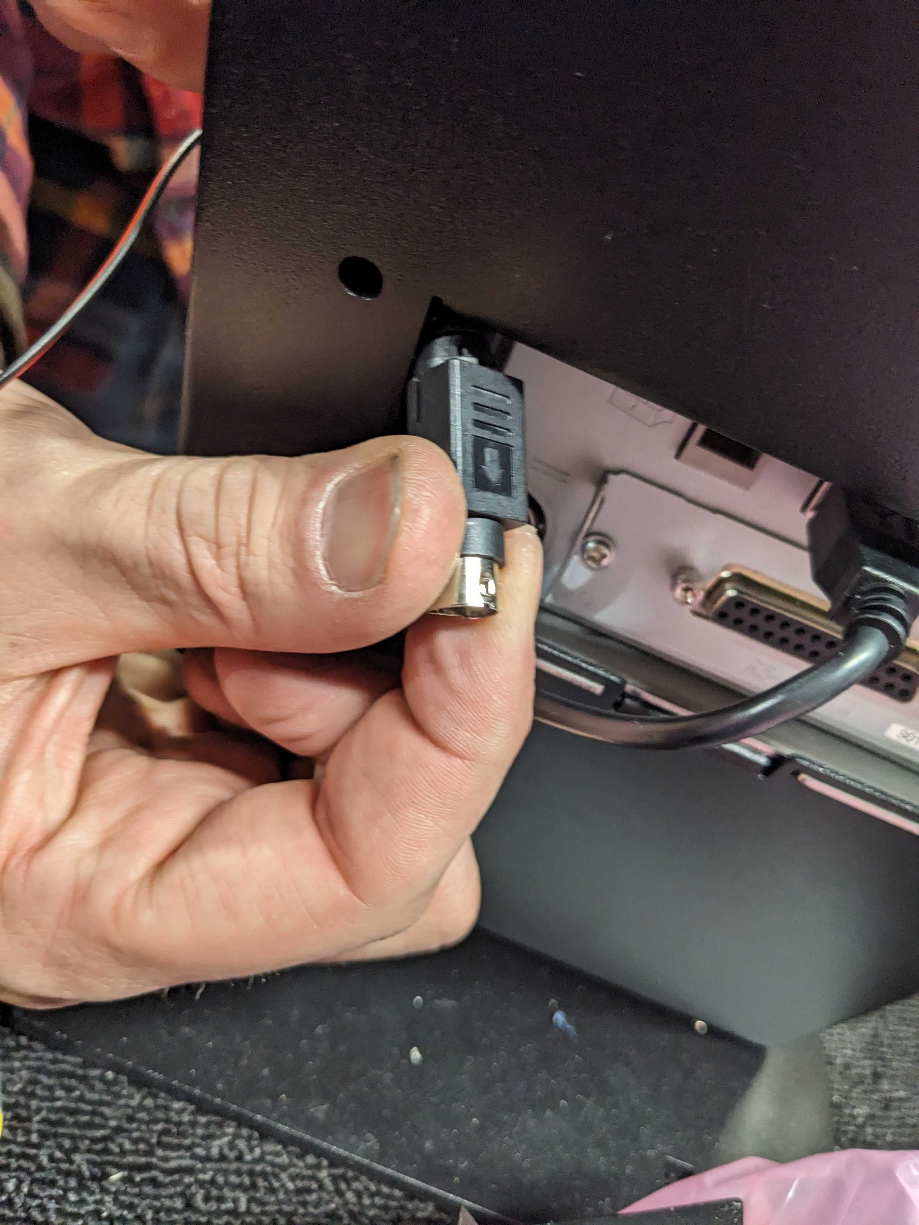 MM6 XP Installation - end of printer power brick cable emerging from back panel opening.png