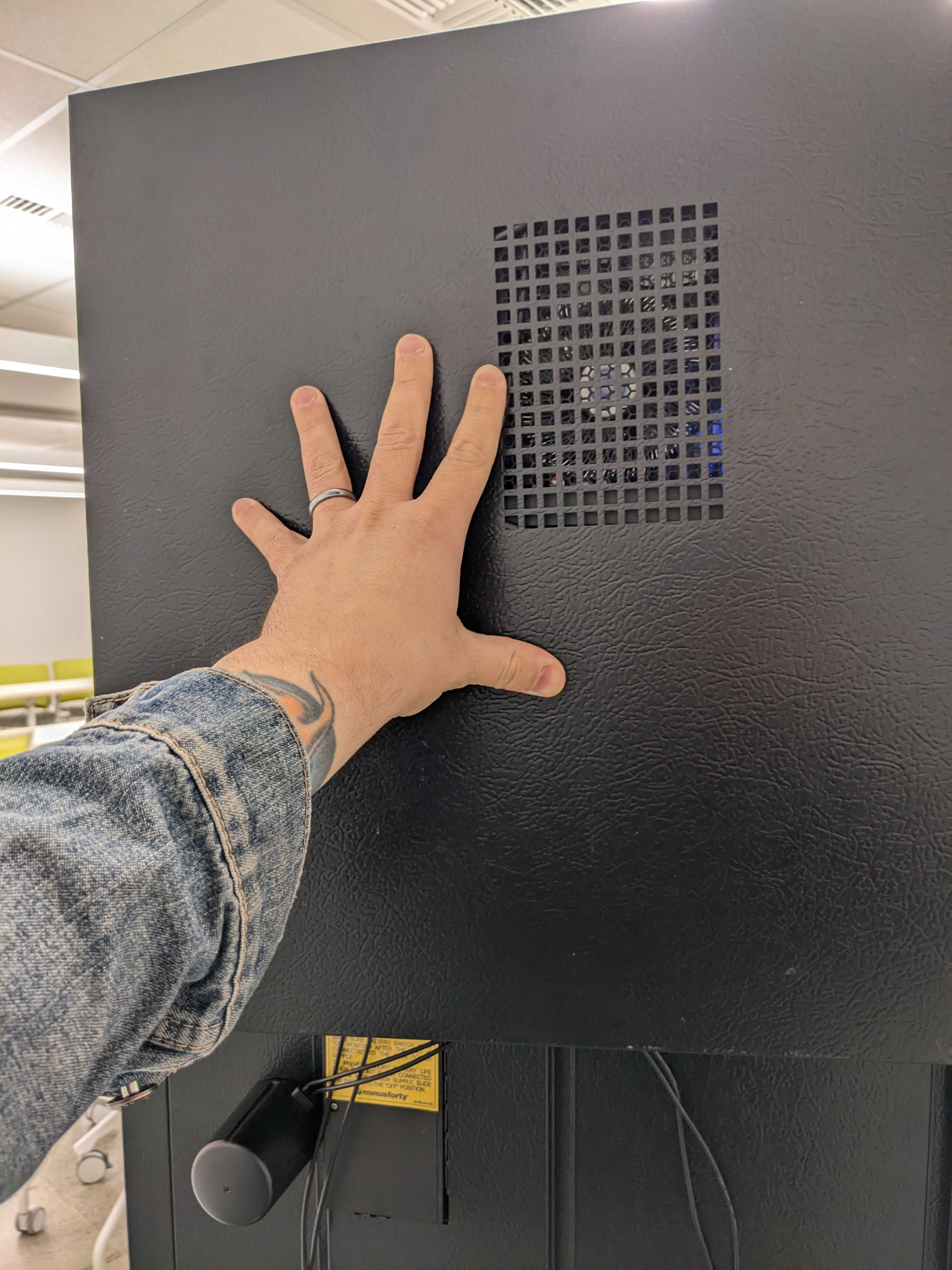 PicoCooler Vision - Back Cover Panel held in place by technician.png