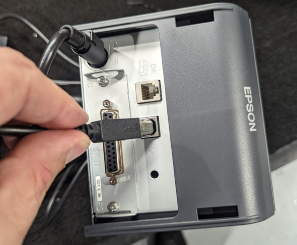 A photo of the Epson printer having its USB cable plugged in